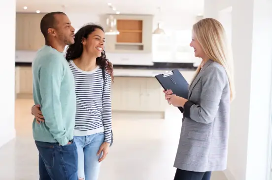 Banker talking to a couple about financing